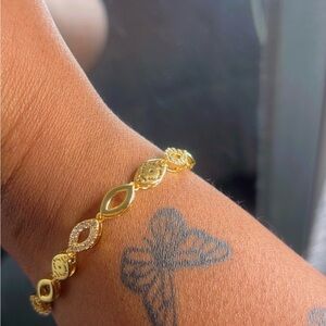 Gold Dainty Bracelet with Intricate Design and Gemstones